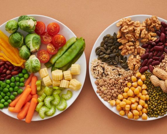 A vibrant flatlay of colorful vegetables and nuts showcasing a balanced diet concept.