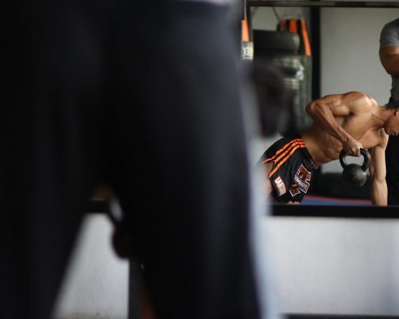 man in black and orange shorts